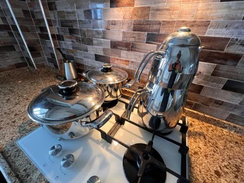 a stove with two pots and a blender on it at Shen Home Life in Trabzon