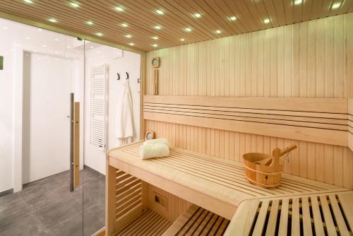 a sauna with a bench and a shower at B-Lodge Kärnten in Kirchbach