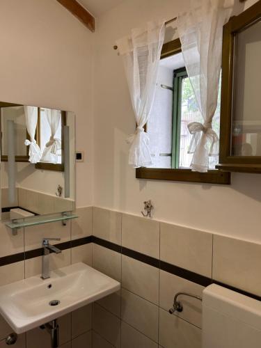 a bathroom with a sink and a mirror at Gaya apartments in Šibenik