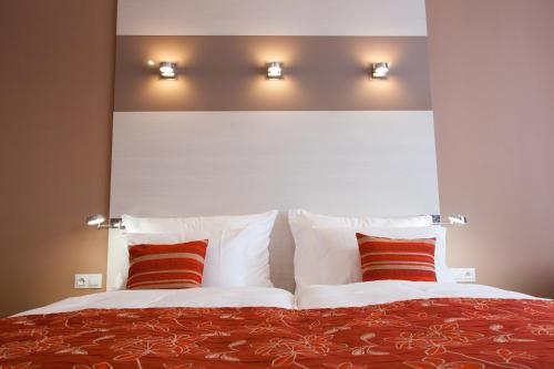 Postel nebo postele na pokoji v ubytování Penzion Na Valech Hodonín