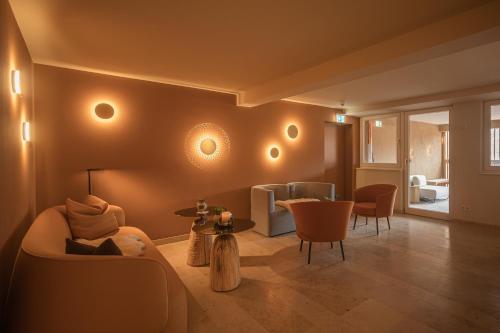 a living room with a couch and a table at Hotel Restaurant zur Sonne St. Peter in Sankt Peter