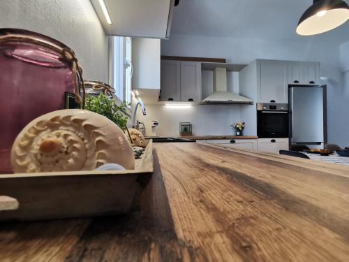a kitchen with a wooden counter top in a room at Mantalena's house in Antiparos
