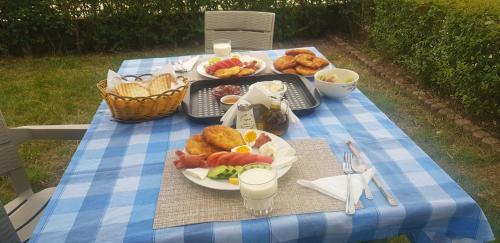 a picnic table with a tray of food on it at Guest House Ilir in Berat