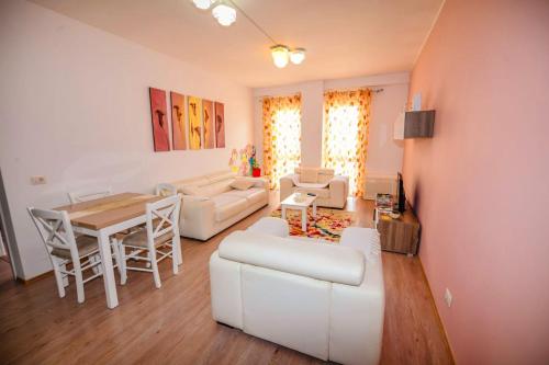 A seating area at Happy stories' apartment in city centre
