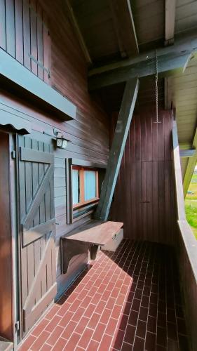 a bench sitting in the inside of a building at Appartamento Fronte Piste in Auronzo di Cadore