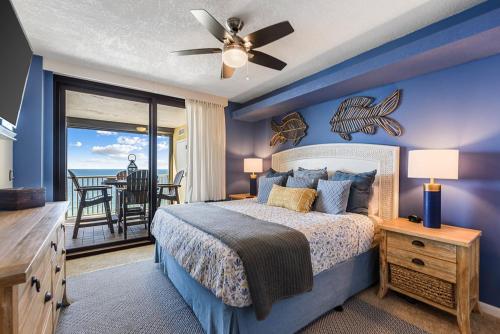 a bedroom with a bed and a view of the ocean at Summer House 901A by ALBVR - Gorgeous Beachfront Corner Condo with Incredible Views in Orange Beach