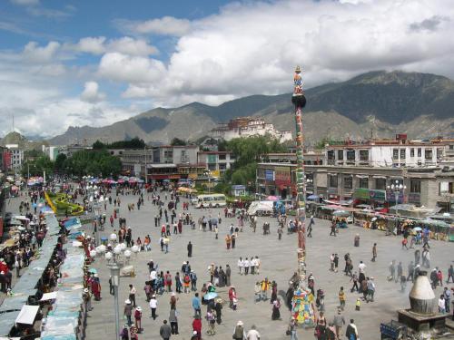 a large crowd of people walking around a city at B&B Piccolo Tibet in Lavenone