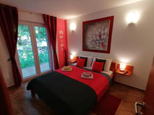 a bedroom with a large bed and a window at The Forest House Krk 1 in Kras