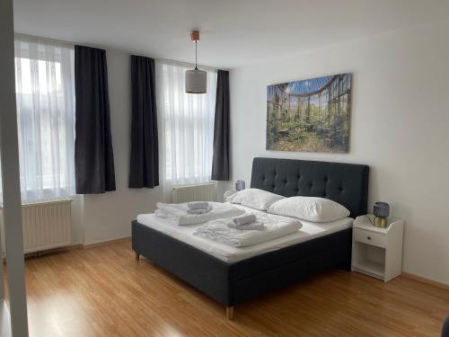 Giường trong phòng chung tại Peaceful Apartment for 4