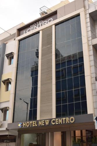 a building with a hotel new centric sign on it at Hotel New Centro in Gulbarga