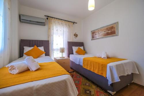 เตียงในห้องที่ YİĞİT APART