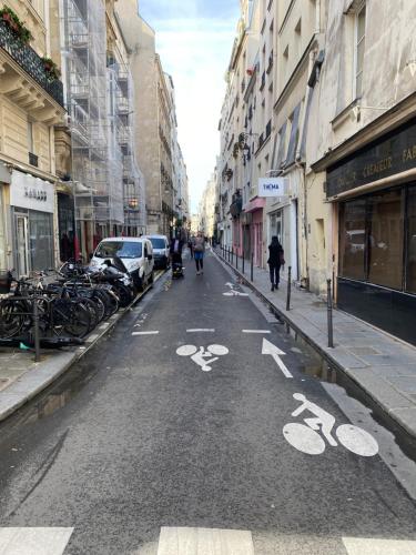 an empty city street with bikes on the road at Paris Marais Arev in Paris