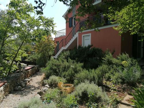 a garden in front of a house at The Forest House Krk 1 in Kras