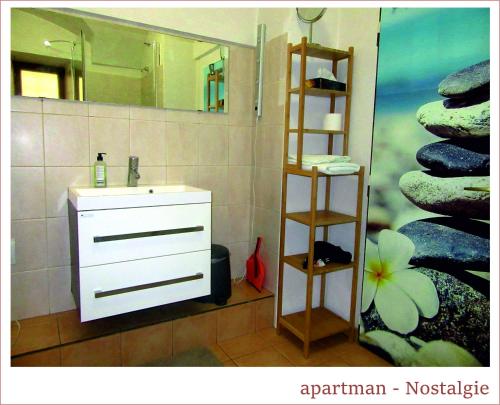 a bathroom with a sink and a mirror at Apartmán U Kostela in Veselí nad Moravou