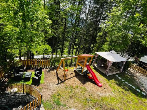 a playground with a slide and a swing set at Casa Vacanze Natura in Mendola