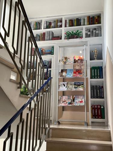 a staircase with an open refrigerator in a house at La Locomotiva Rooms in Chiaravalle
