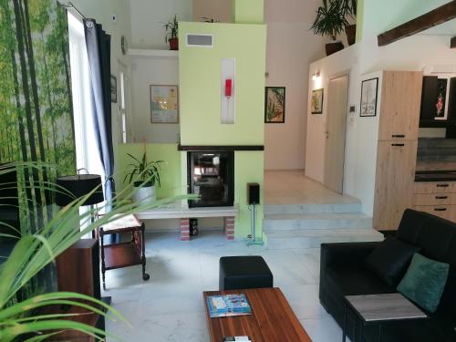 a living room with a couch and a fireplace at The Forest House Krk 2 in Kras