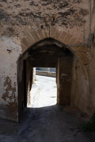 an archway in an old building with a stone wall at Giulietta Normanna in Sciacca
