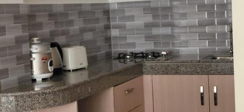 a kitchen with a counter top with a coffee maker at Seaview Mansion Dalaguete Deluxe Apartment 6 in Dalaguete