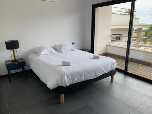Posteľ alebo postele v izbe v ubytovaní Appartement - Maison "Le pied à terre 1" PORTICCIO