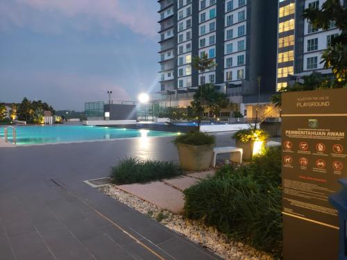 a swimming pool in the middle of a building at MyHome 2B At Seri Kembangan With A View in Seri Kembangan