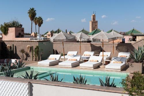 a resort with a swimming pool and lounge chairs at 72 Hotel & Spa in Marrakech