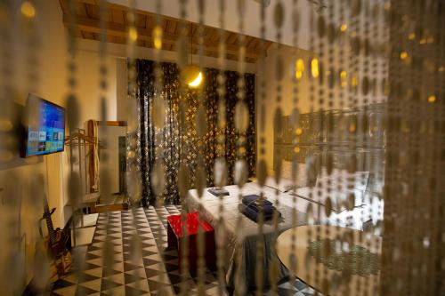 a glass window of a room with a table at Casuzza al Duomo con vista Valle dei Templi! in Agrigento