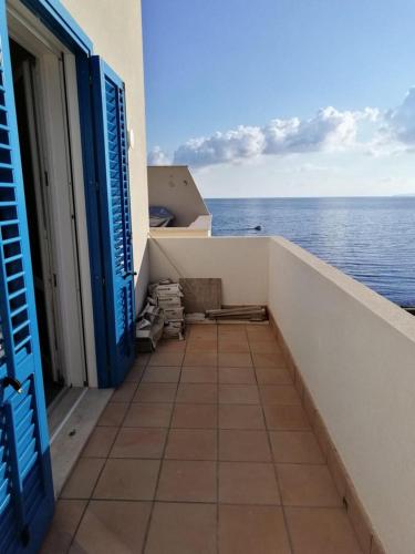 a balcony with a view of the ocean at Blu Rooms Marettimo in Marettimo