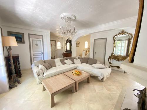 a living room with a couch and a coffee table at Villa Daurus in Vallauris