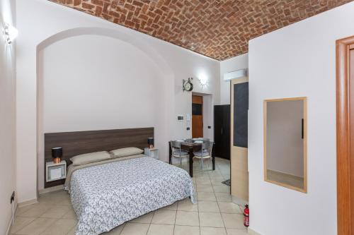 En eller flere senge i et værelse på IN CORTILE