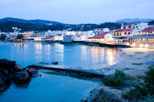 a view of a town with a river and buildings at Sia's Sea House in Almirida