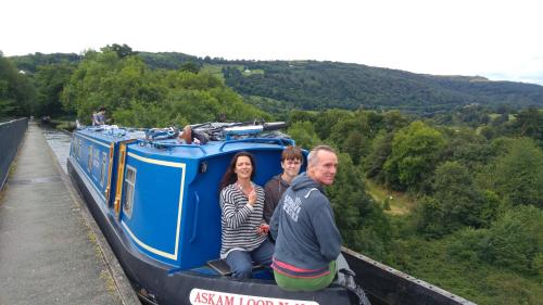 a group of people riding on a train at Narrowboat canal holiday from19th august in Aldermaston