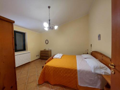 a bedroom with a large bed and a window at Tenuta Armida Relax & Pool in Liberi