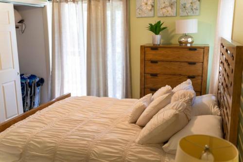 a bedroom with a large bed with white pillows at North Ocean city newly Remodeled in Ocean City