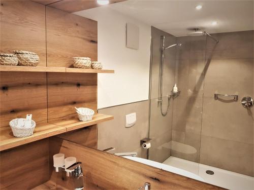 a bathroom with a shower and a tub and a sink at Hotel-Restaurant Pfälzer Hof in Edenkoben