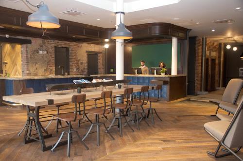 a conference room with a long table and chairs at The Old No. 77 Hotel & Chandlery in New Orleans