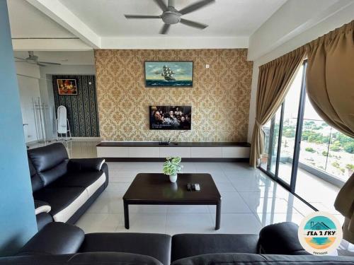a living room with a couch and a table at Sky2Sea Penthouse @ Icon Residences in Kuala Terengganu
