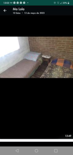 Una foto de una habitación con 2 camas individuales. en Cabaña El Tala-Tanti in 