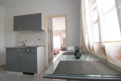 a kitchen with a sink and a counter top at Chrys Marie Studios in Iraion