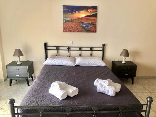 Ένα ή περισσότερα κρεβάτια σε δωμάτιο στο Armonia Apartments