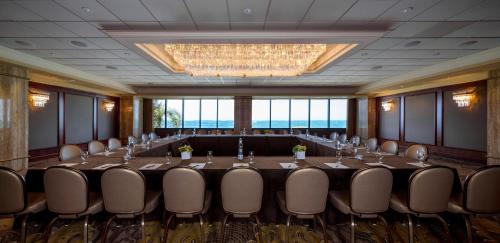 a conference room with a long table and chairs at Condado Vanderbilt Hotel in San Juan