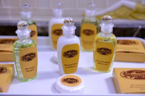 a group of bottles of soap on a table at AllureInn Hotel and Spa in Chernivtsi
