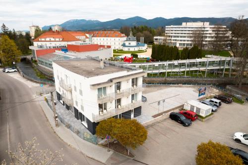 an aerial view of a city with a building at Ubytovanie Biely dom in Turčianske Teplice