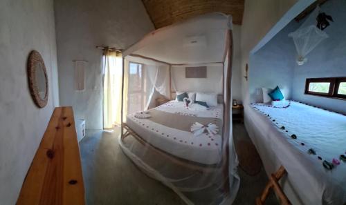 a bedroom with two beds in a room at Beekite Wind Village in Luis Correia