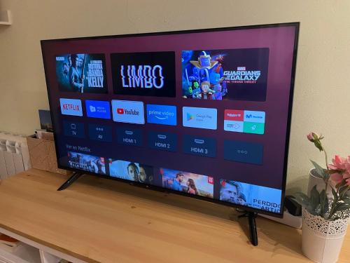 a flat screen tv sitting on top of a table at Apartamento vacacional in El Pont de Suert