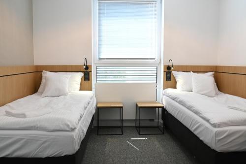 Una cama o camas en una habitación de Hotel Parrot