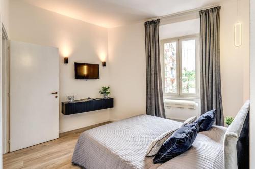 Una cama o camas en una habitación de Vatican Charming Home