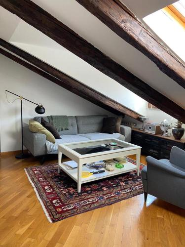 a living room with a couch and a coffee table at Rive Trieste in Trieste