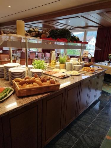 a buffet line with bread and other food on it at RECHTMURG 27 in Baiersbronn