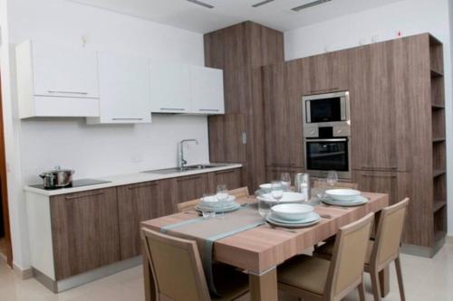 Η κουζίνα ή μικρή κουζίνα στο Quisisana Apartments - Cast Renting